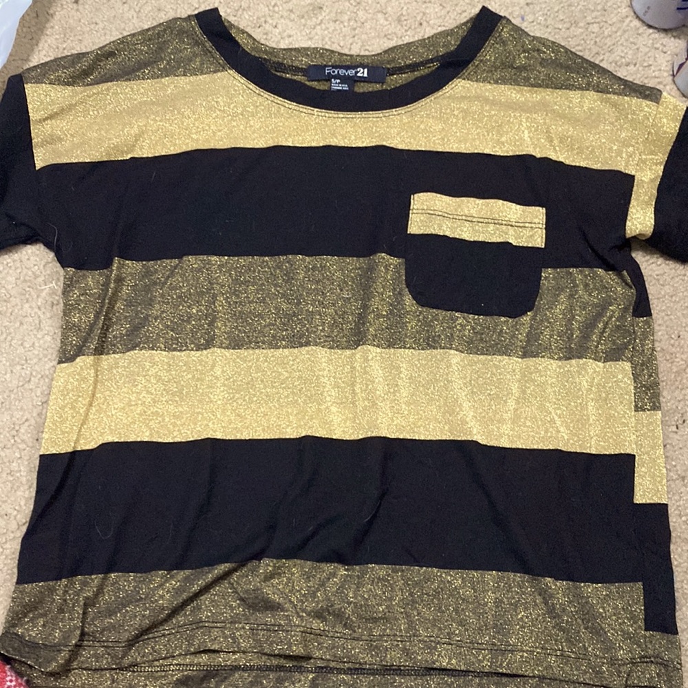 T shirt, shimmery top with a front pocket